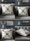 Floral embroidered throw pillow with swirls on gray sofa, home decor accent